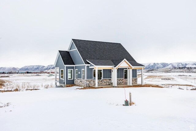 2678 S Eagle Dr Unit 12, Garden City, UT 84028 - view of front of property featuring board and batten siding, stone siding, and a mountain view