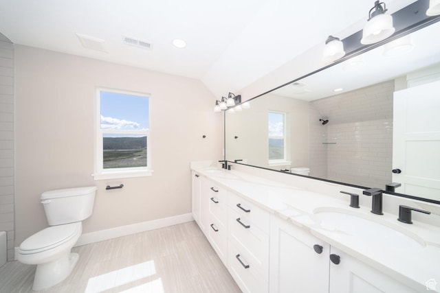 2678 S Eagle Dr Unit 12, Garden City, UT 84028 - bathroom with toilet, visible vents, tiled shower, and a sink