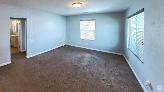 11 W Robert Ave, South Salt Lake, UT 84115 - unfurnished room featuring dark colored carpet and baseboards