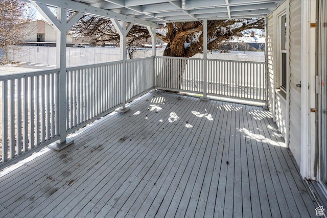 wooden terrace featuring fence