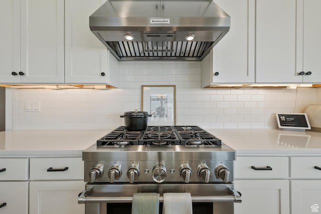 4784 W Juniper Bend Cir, Herriman, UT 84096 - kitchen with tasteful backsplash, high end stove, white cabinetry, and ventilation hood