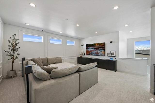 4784 W Juniper Bend Cir, Herriman, UT 84096 - living room featuring recessed lighting, light colored carpet, and baseboards