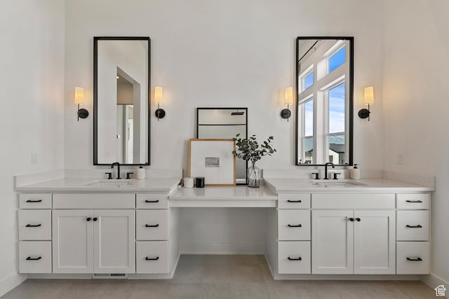 4784 W Juniper Bend Cir, Herriman, UT 84096 - full bath featuring two vanities, baseboards, and a sink