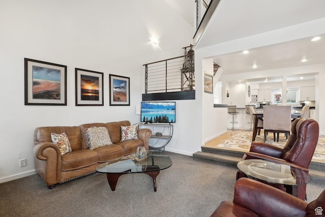 71 W Apricot Ave, Salt Lake City, UT 84103 - carpeted living room with recessed lighting, baseboards, and a towering ceiling