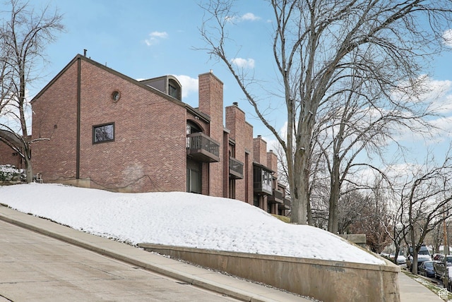71 W Apricot Ave, Salt Lake City, UT 84103 - snow covered property featuring brick siding