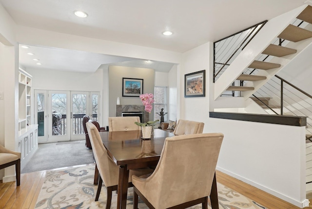 71 W Apricot Ave, Salt Lake City, UT 84103 - dining room with stairway, recessed lighting, a fireplace, and light wood-style floors