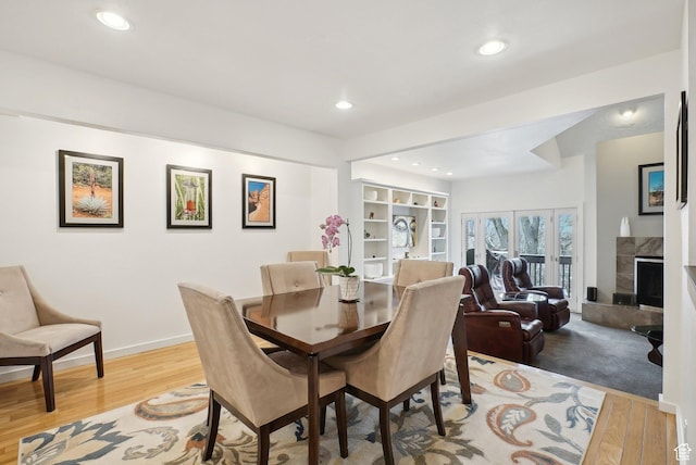 71 W Apricot Ave, Salt Lake City, UT 84103 - dining space with recessed lighting, baseboards, light wood finished floors, and a tile fireplace