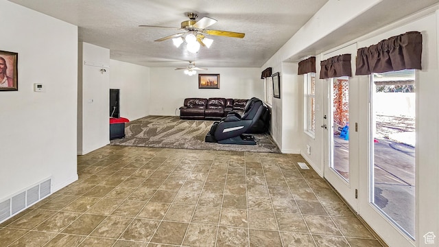 135 E 1200 N, Mapleton, UT 84664 - living area featuring a ceiling fan, a textured ceiling, baseboards, and visible vents