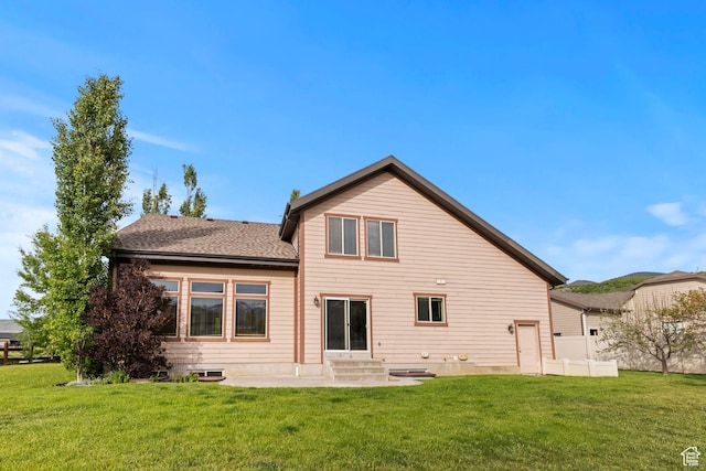 5927 Dartmouth Dr, Mountain Green, UT 84050 - back of property with a yard, entry steps, a patio, and a shingled roof