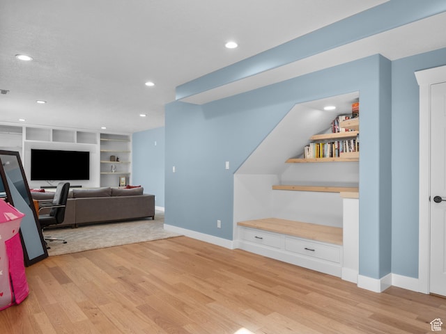 5927 Dartmouth Dr, Mountain Green, UT 84050 - living area with light wood-type flooring, baseboards, built in shelves, and recessed lighting