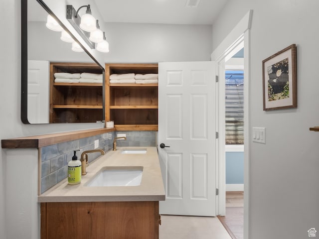5927 Dartmouth Dr, Mountain Green, UT 84050 - bathroom with double vanity, decorative backsplash, and tile patterned floors
