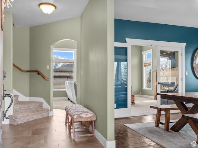 5927 Dartmouth Dr, Mountain Green, UT 84050 - foyer entrance with baseboards, stairway, and arched walkways