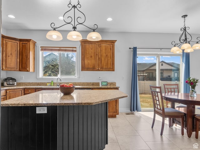 5927 Dartmouth Dr, Mountain Green, UT 84050 - kitchen featuring a chandelier, brown cabinetry, a sink, a kitchen island, and recessed lighting