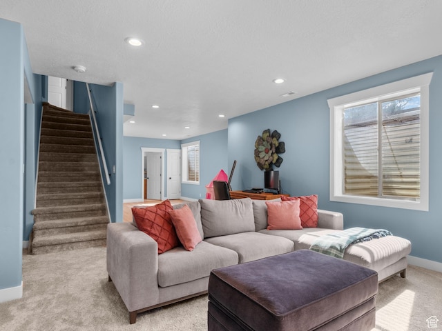 5927 Dartmouth Dr, Mountain Green, UT 84050 - living area featuring light carpet, stairway, baseboards, plenty of natural light, and recessed lighting