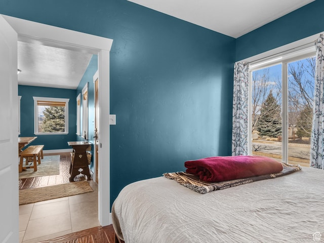 5927 Dartmouth Dr, Mountain Green, UT 84050 - tiled bedroom featuring baseboards