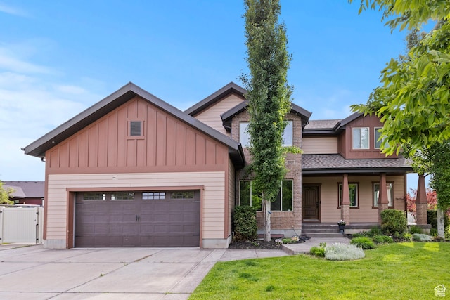 5927 Dartmouth Dr, Mountain Green, UT 84050 - craftsman inspired home featuring board and batten siding, a front yard, covered porch, concrete driveway, and a gate