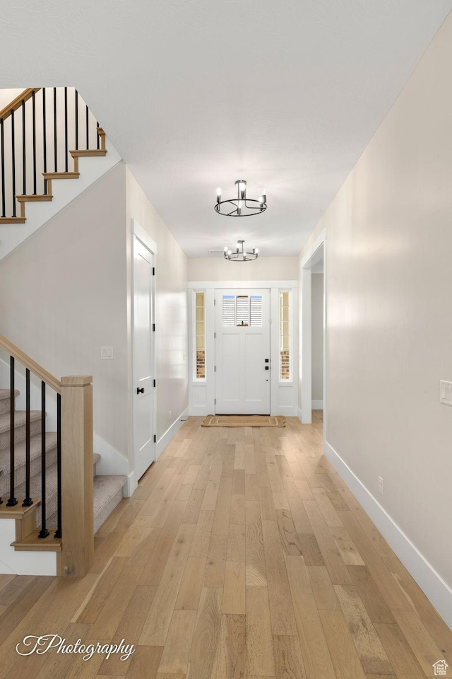 2092 S 3010 E, St George, UT 84790 - entryway with an inviting chandelier, baseboards, stairs, and light wood-style floors