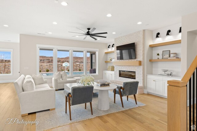 2092 S 3010 E, St George, UT 84790 - living area with recessed lighting, light wood-type flooring, a brick fireplace, and ceiling fan