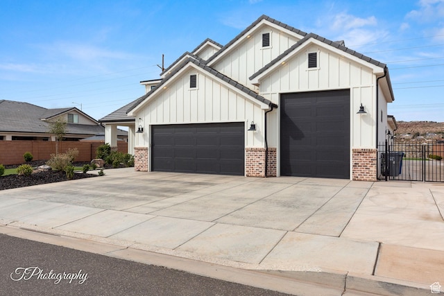2092 S 3010 E, St George, UT 84790 - modern farmhouse style home featuring concrete driveway, a garage, fence, and board and batten siding