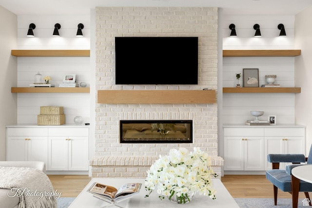 2092 S 3010 E, St George, UT 84790 - living area with light wood-style flooring and a fireplace