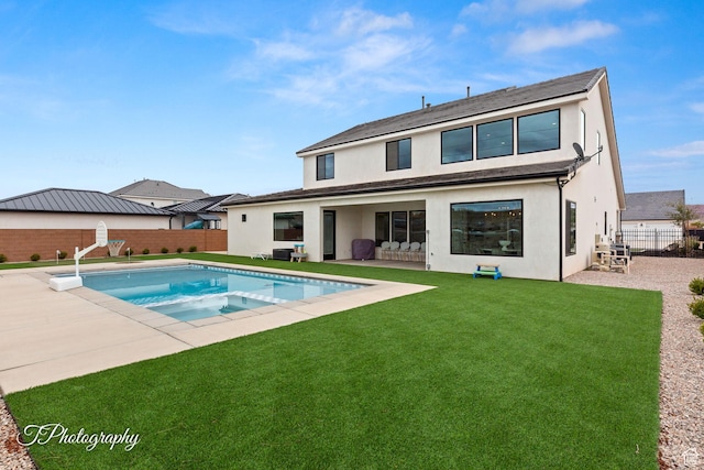 2092 S 3010 E, St George, UT 84790 - back of property featuring stucco siding, a yard, a fenced backyard, and a patio area
