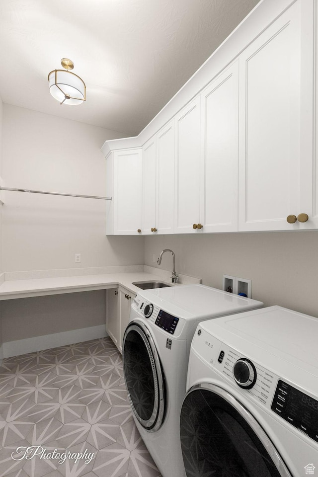 2092 S 3010 E, St George, UT 84790 - laundry room with washer and clothes dryer, cabinet space, baseboards, and a sink