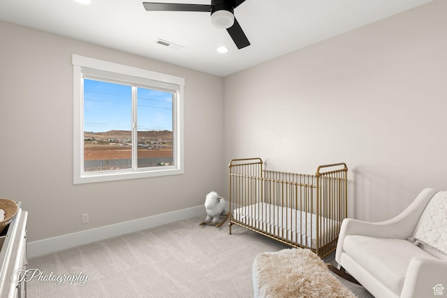 2092 S 3010 E, St George, UT 84790 - bedroom with baseboards, visible vents, carpet floors, ceiling fan, and a nursery area