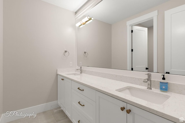2092 S 3010 E, St George, UT 84790 - full bathroom featuring tile patterned floors, double vanity, baseboards, and a sink