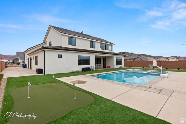 2092 S 3010 E, St George, UT 84790 - view of swimming pool with a patio, a yard, a fenced backyard, and a pool with connected hot tub