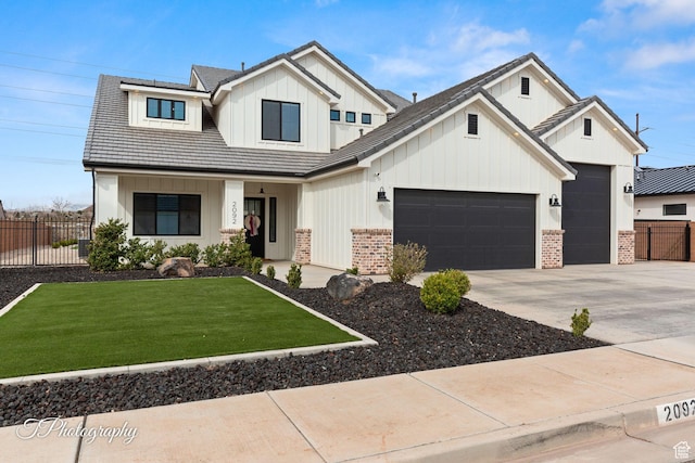 2092 S 3010 E, St George, UT 84790 - modern farmhouse featuring fence, a front lawn, concrete driveway, a garage, and board and batten siding