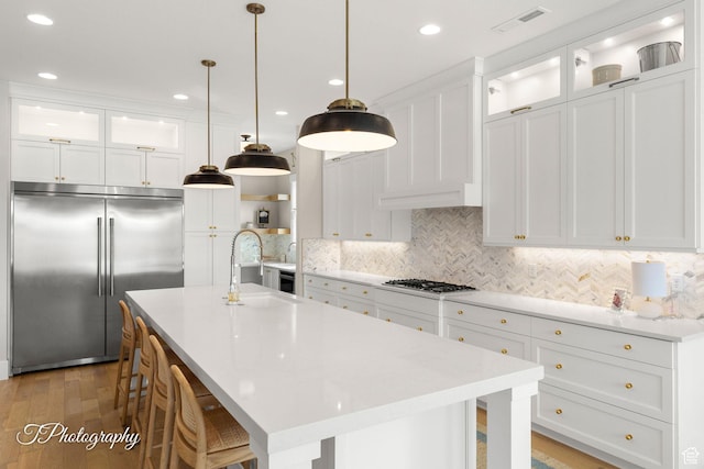 2092 S 3010 E, St George, UT 84790 - kitchen with visible vents, light countertops, white cabinets, gas stovetop, and built in fridge