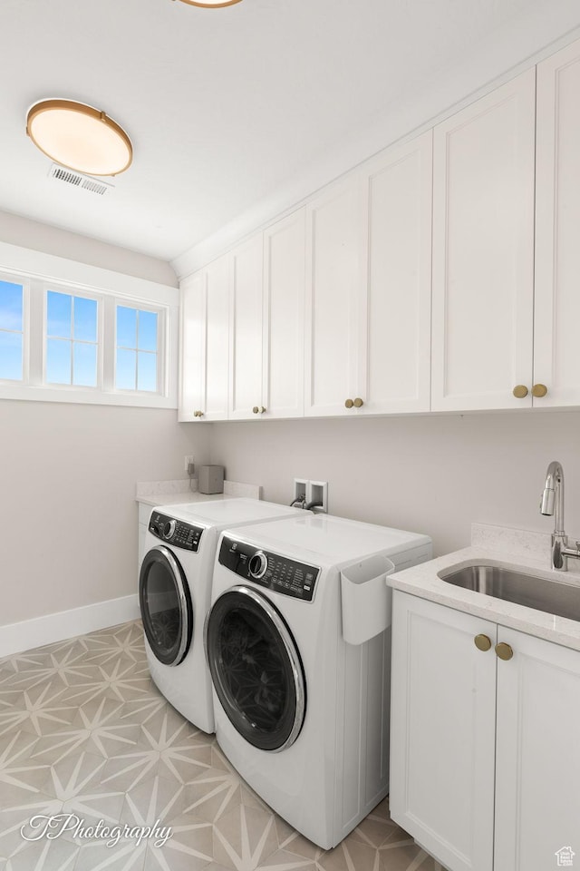 2092 S 3010 E, St George, UT 84790 - laundry room with visible vents, a sink, cabinet space, separate washer and dryer, and baseboards