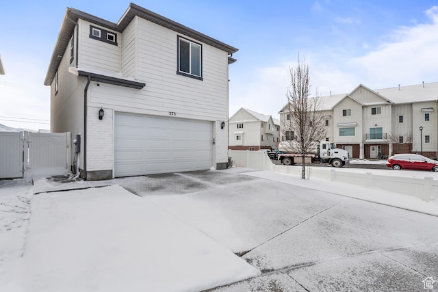 373 S 850 E, American Fork, UT 84003 - view of side of property featuring a gate, an attached garage, fence, and a residential view