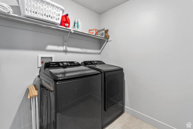 373 S 850 E, American Fork, UT 84003 - laundry area with light tile patterned floors, laundry area, washer and dryer, and baseboards