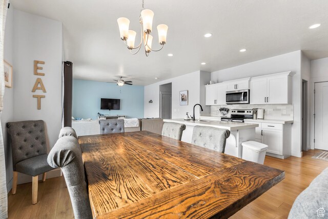 373 S 850 E, American Fork, UT 84003 - dining area with ceiling fan with notable chandelier, light wood-style flooring, and recessed lighting