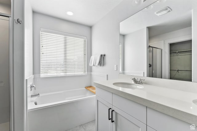 373 S 850 E, American Fork, UT 84003 - full bathroom featuring a shower stall, a walk in closet, double vanity, a bath, and a sink