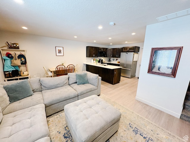 1788 N 1280 E, Payson, UT 84651 - living area featuring recessed lighting, light wood-type flooring, baseboards, and a textured ceiling