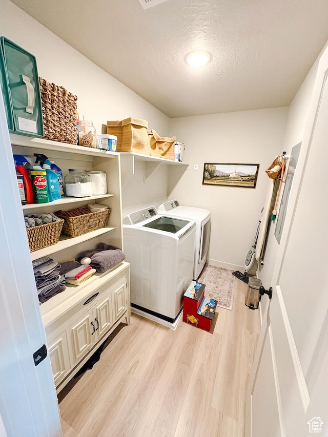1788 N 1280 E, Payson, UT 84651 - clothes washing area featuring washing machine and clothes dryer, baseboards, light wood-type flooring, laundry area, and a textured ceiling