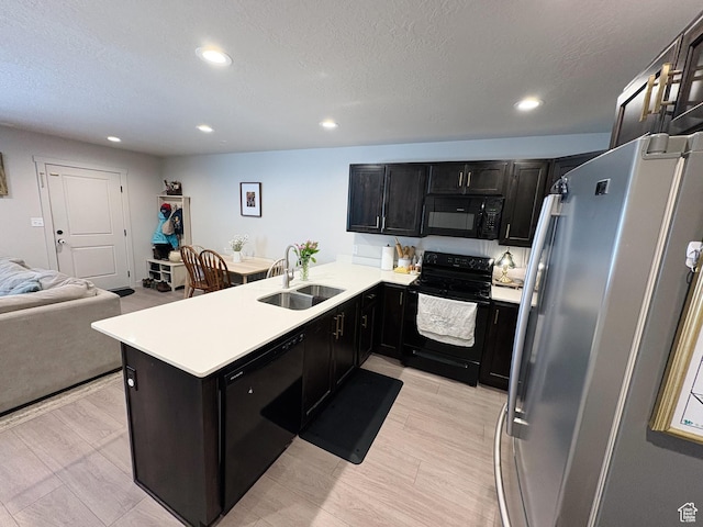 1788 N 1280 E, Payson, UT 84651 - kitchen featuring black appliances, a sink, open floor plan, a peninsula, and light countertops