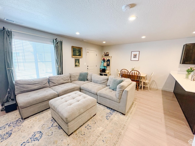 1788 N 1280 E, Payson, UT 84651 - living room with baseboards, visible vents, recessed lighting, light wood-style floors, and a textured ceiling