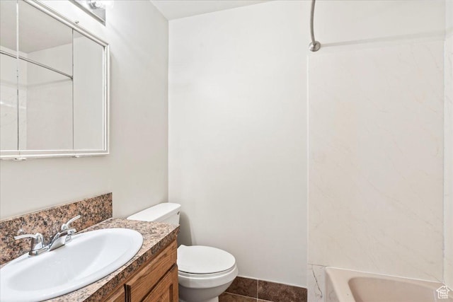 bathroom featuring tile patterned floors, toilet, shower / bathing tub combination, and vanity