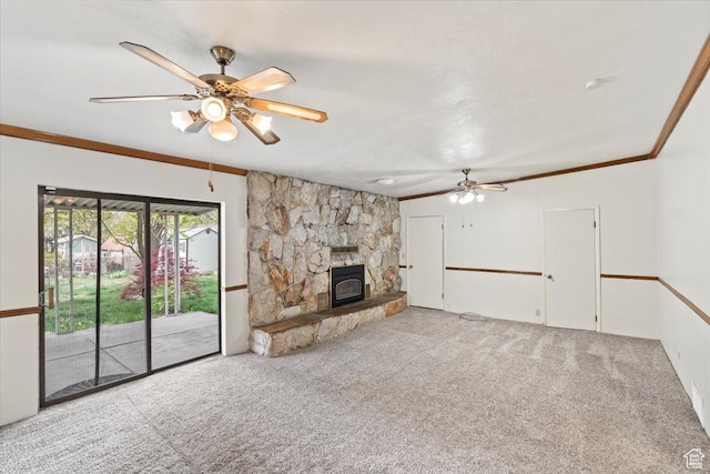 unfurnished living room with crown molding, a ceiling fan, and carpet floors