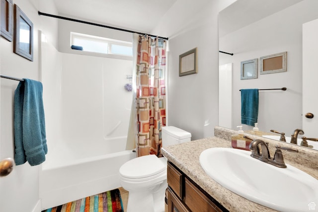 bathroom with shower / bath combination with curtain, toilet, and vanity