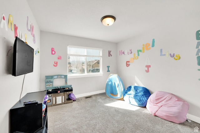 playroom with baseboards, carpet floors, and visible vents