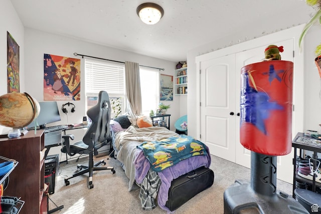 carpeted bedroom with a closet