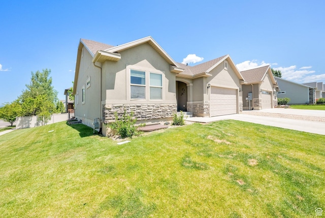 415 E Acord Way, Heber City, UT 84032 - view of front of home featuring an attached garage, concrete driveway, stone siding, and stucco siding