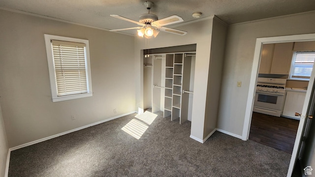 1330 N 800 W, Provo, UT 84604 - unfurnished bedroom featuring ornamental molding, a ceiling fan, a closet, dark colored carpet, and baseboards