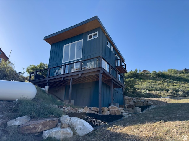 203 Valleyview, Coalville, UT 84017 - rear view of house featuring a wooden deck and board and batten siding