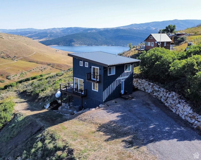 203 Valleyview, Coalville, UT 84017 - view of front of property featuring a metal roof and a deck with mountain view