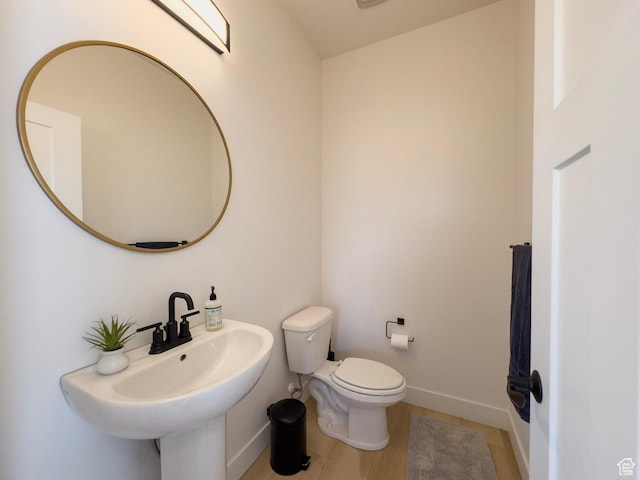 203 Valleyview, Coalville, UT 84017 - half bath featuring baseboards and wood finished floors